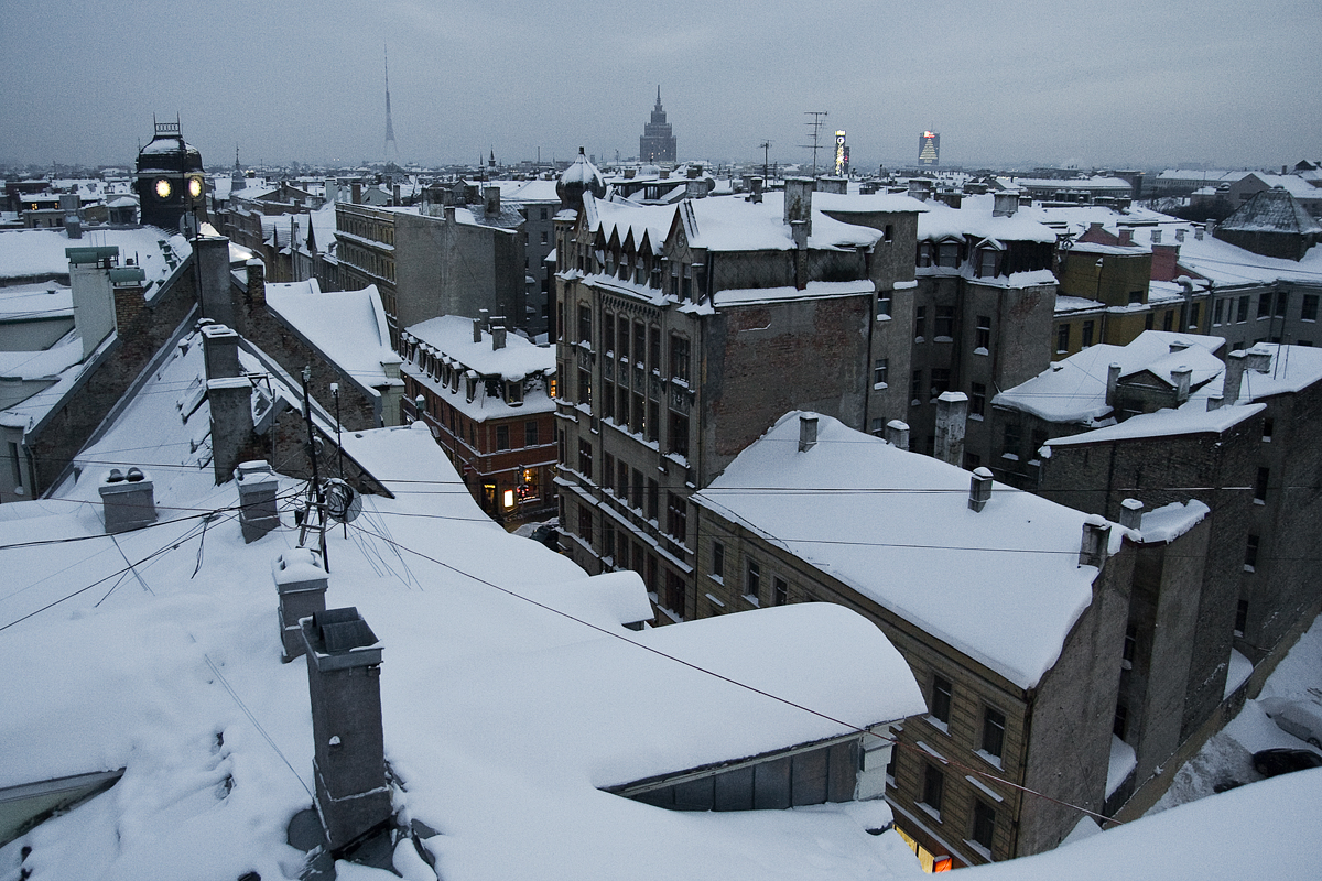 Snowy Roofs Of City