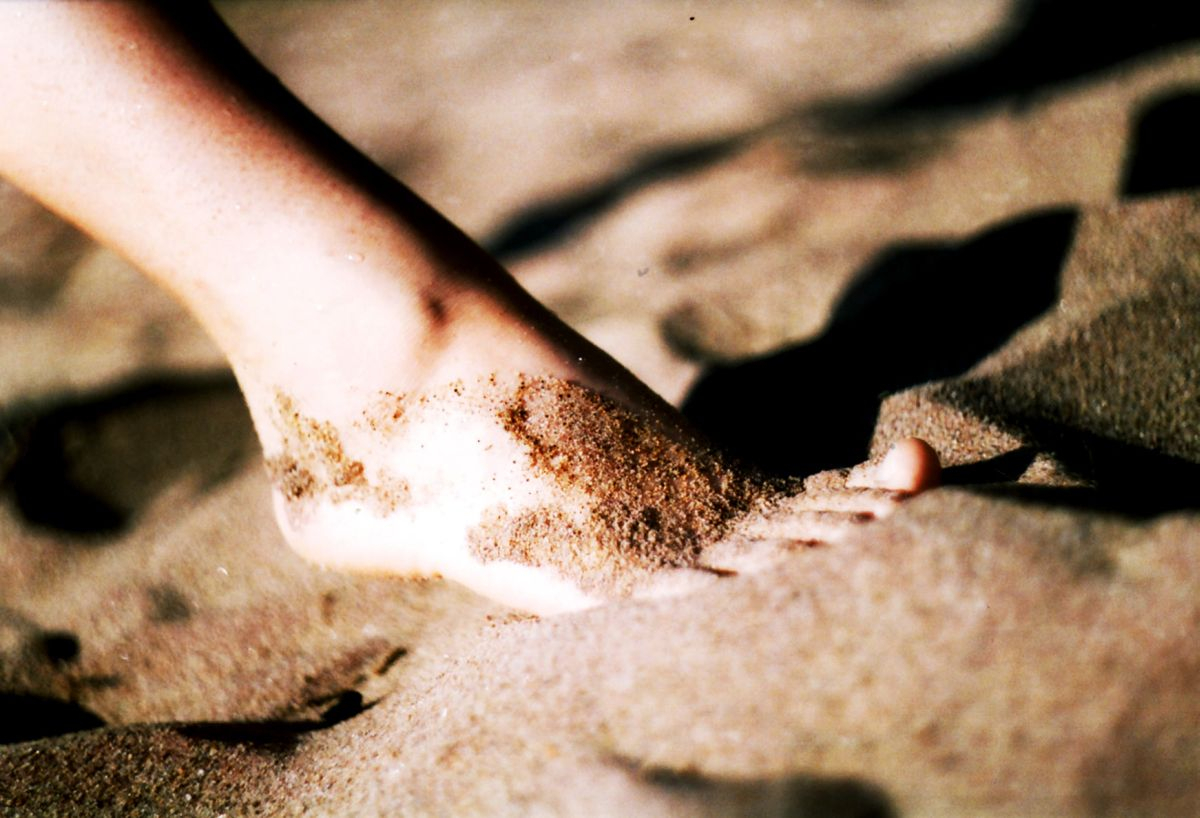Bare foot on beach sand via @atisgailis