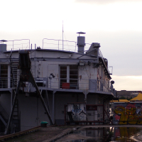 A boat docked in the water.