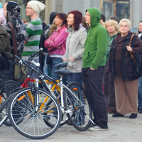 A group of people standing in front of a building during a Dzelzs vilks ielīgo '09 event.