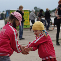 A girl wearing a pink jacket at the ielīgo '09 festival.