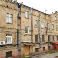 A Iļģuciems building with many windows.