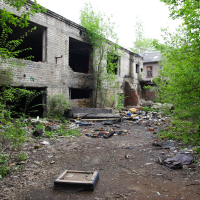 An abandoned building in the Iļģuciems wooded area.