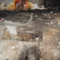 A room in Iļģuciems neighborhood with a fire in it.