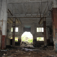 A Iļģuciems building with a lot of dirt and rubble.