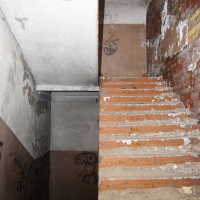 A graffiti-adorned stairway in Iļģuciems.