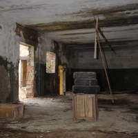 A room in Iļģuciems with a lot of dirt on the floor.