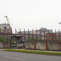A crane in front of a building in Iļģuciems.