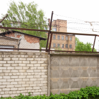 A barbed wire fence in Iļģuciems.