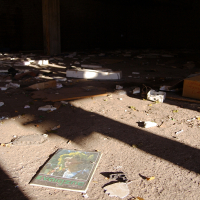 A pile of Skulte books on the floor.
