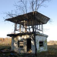 A Skulte building overlooking a field.