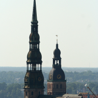 A clock-topped building in Riga seen from above.