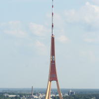 A towering structure amidst Riga's aquatic expanse, offering breathtaking views from above.