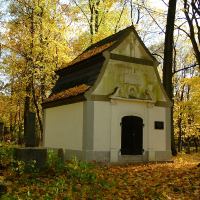 A small white building nestled in the St. Martin's cemetery.