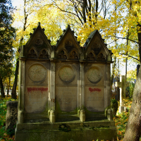 A cluster of gravestones adorned with leaves in St. Martin's cemetery.