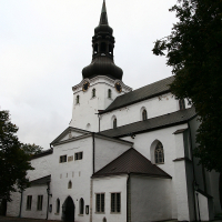 A Tallinn building with a black spire.