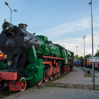 A train museum featuring a green and black train.