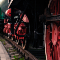 A train with vibrant colored wheels is displayed at the Train museum.