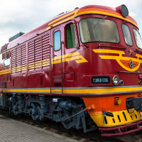 A vibrant train in a museum.