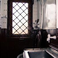 A train museum with a bathroom and a window.