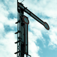 A train museum exhibit featuring a metal pole with a light on it.