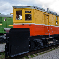 A colorful train displayed at a train museum.