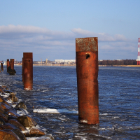 A group of rusty poles near Voleri.