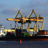 A Voleri container ship docked at a dock.