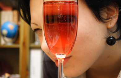 A Woman Holding A Champagne Glass.
