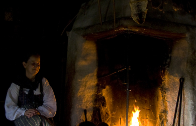 A Woman Seated By The Hearth.