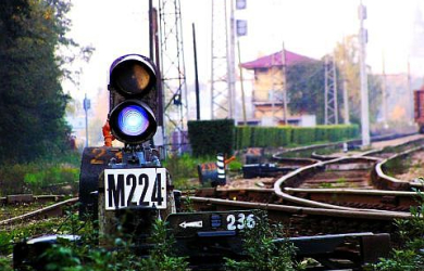 A Railway Signal Displaying Lights On A Train Track.