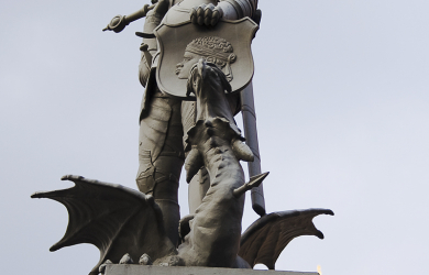 A Sv. Juris Statue Of A Knight Atop A Building.