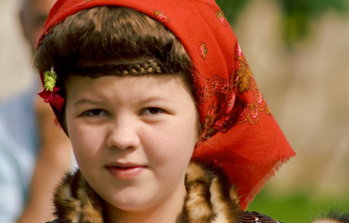 A Romanian Girl In A Traditional Costume.