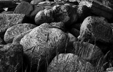 A Monochromatic Photograph Showcasing A Heap Of Stones.
