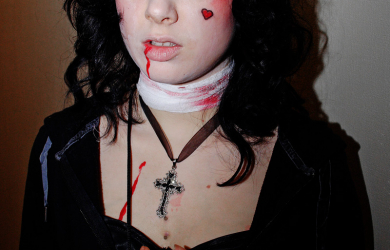 A Vampire Woman With Blood On Her Face, Deeply In Love.